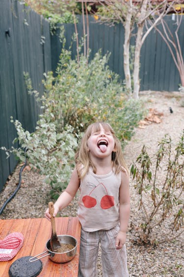 Los Angeles, CA - December 04: Stella Penn stands at an outdoor kitchen with a Matilija Poppy, cente...