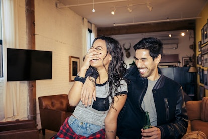 Couple laughing in an article about april fools day pranks