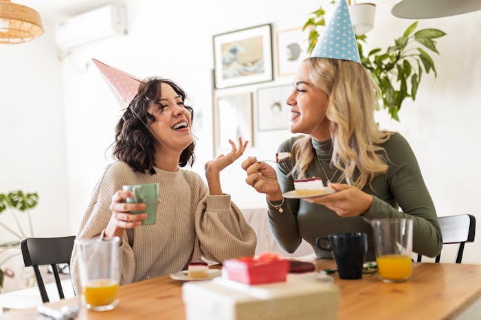 Best friends having little birthday celebration at home