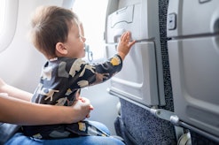 Flight attendants are saying that turbulence makes keeping babies on laps during flights more diffic...
