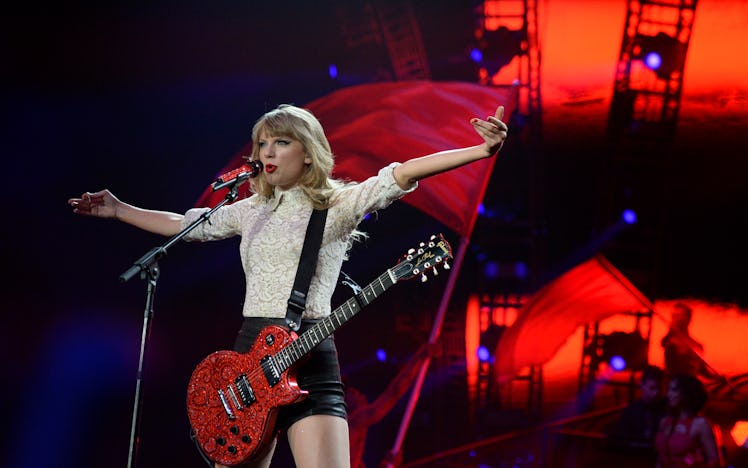 Taylor Swift performing on the 'Red' tour is part of the 'Red' era, which is one of Taylor Swift's e...