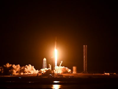 The SpaceX Falcon 9 rocket with the companys Crew Dragon spacecraft lifts off from pad 39A for the C...