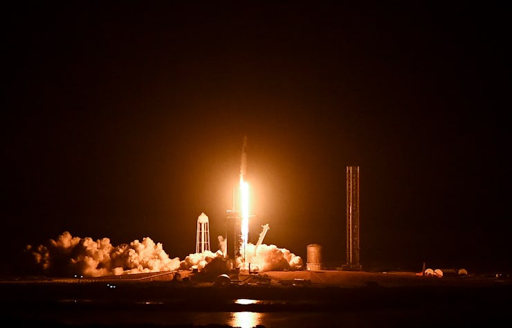 The SpaceX Falcon 9 rocket with the companys Crew Dragon spacecraft lifts off from pad 39A for the C...