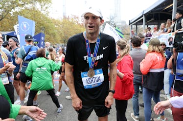 NEW YORK, NEW YORK - NOVEMBER 06:  Actor Ashton Kucher catches his breath after crossing the finish ...