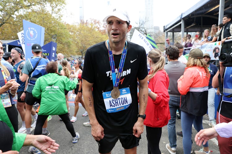 NEW YORK, NEW YORK - NOVEMBER 06: Actor Ashton Kucher catches his breath after crossing the finish ...