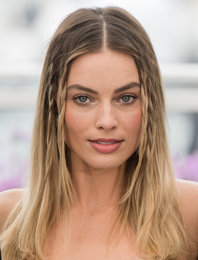 Margot Robbie 70s hair face framing braids at "Once Upon A Time In Hollywood"  photocall