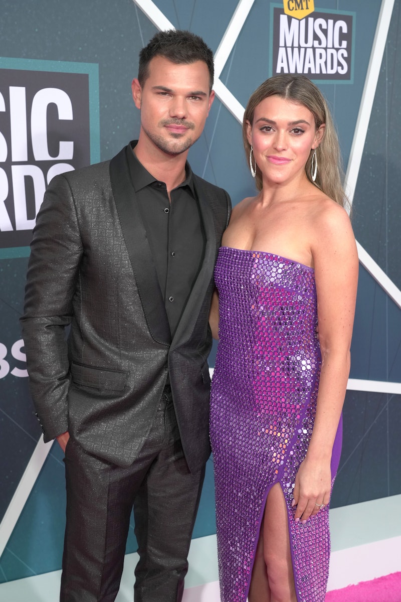 NASHVILLE, TENNESSEE - APRIL 11: Taylor Lautner and Taylor Dome attend the 2022 CMT Music Awards at ...