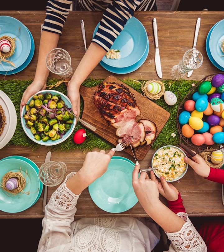 Overhead view on decorated Easter table with family around, in a story about leftover ham recipes.