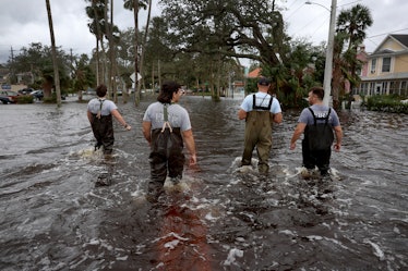 DAYTONA BEACH, FLORIDA - NOVEMBER 10: Members of the Daytona Beach Fire Department walk through floo...