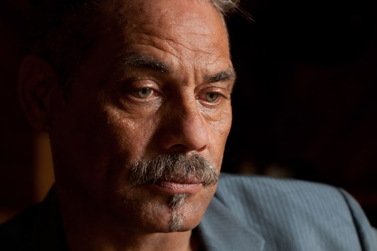 Serious Adult Man Looking Down in Deep Thought