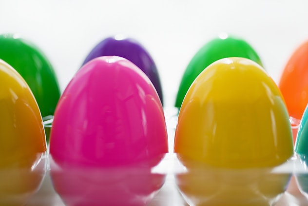 Colorful plastic eggs in an egg carton
