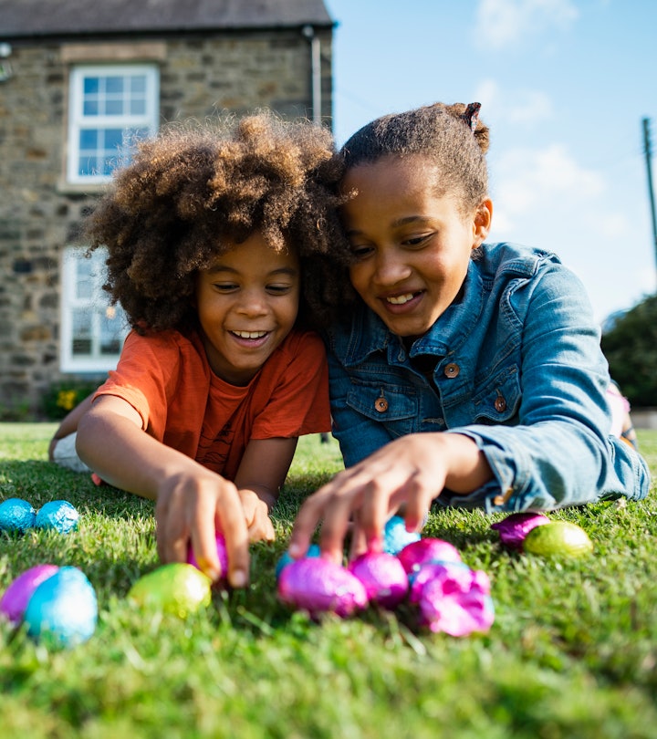 Two kids with easter eggs in a list of Easter bunny ideas for parents.