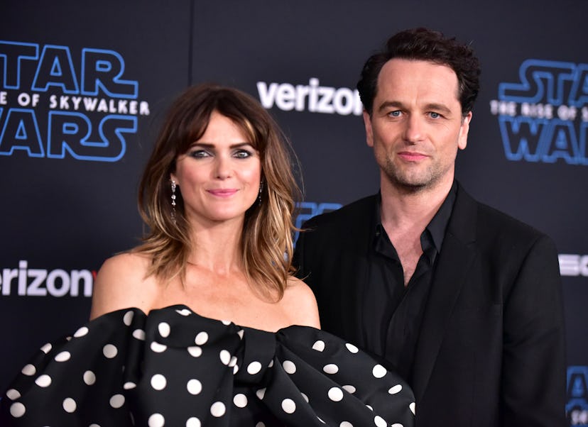 HOLLYWOOD, CALIFORNIA - DECEMBER 16: Keri Russell (L) and Matthew Rhys attend the Premiere of Disne…