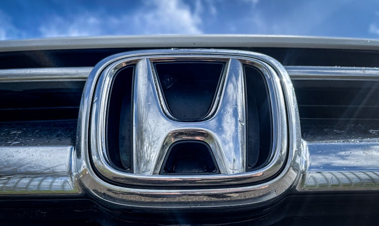 EXETER, UNITED KINGDOM - MARCH 25: Raindrops gather on the logo of the Honda Motor Company on the fr...