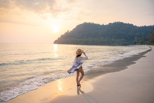 Woman walking on the beach in Ko Kut island