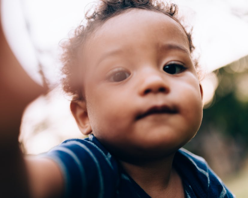 closeup of black baby for article about baby names for babies born in April 