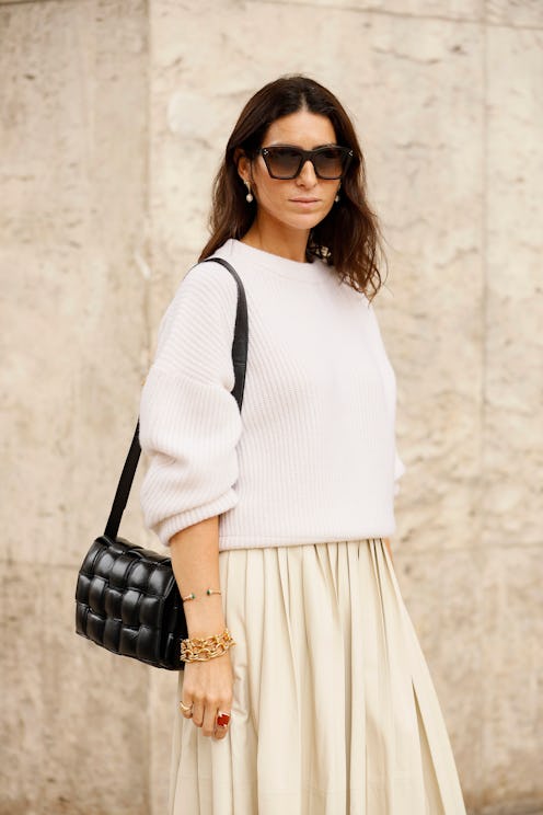 Guest at Bottega Veneta 2019 show with leather woven bag