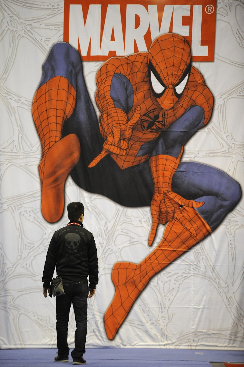 A participant at the New York ComicCon 2009, the city's main comic books fair, walks past a giant Sp...