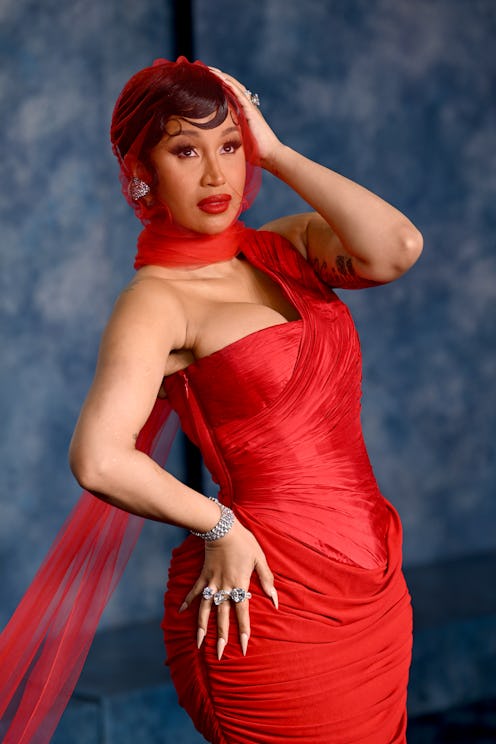 Cardi B's Louboutin-inspired red bottom nails featured white nail polish with a bright red underside...