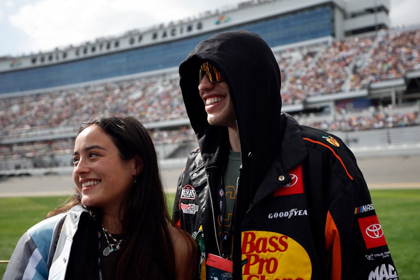 Pete Davidson and Chase Sui wait on the grid prior to the NASCAR Cup Series 65th Annual Daytona 500 ...