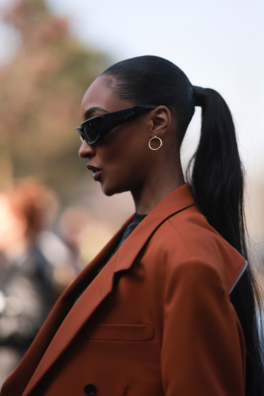 High ponytails are a  Paris Fashion Week Fall/Winter 2023 street style beauty trend.