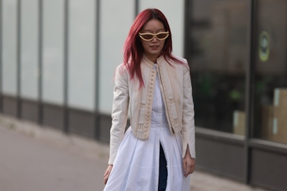 Bright hair colors are a Paris Fashion Week Fall/Winter 2023 street style beauty trend.