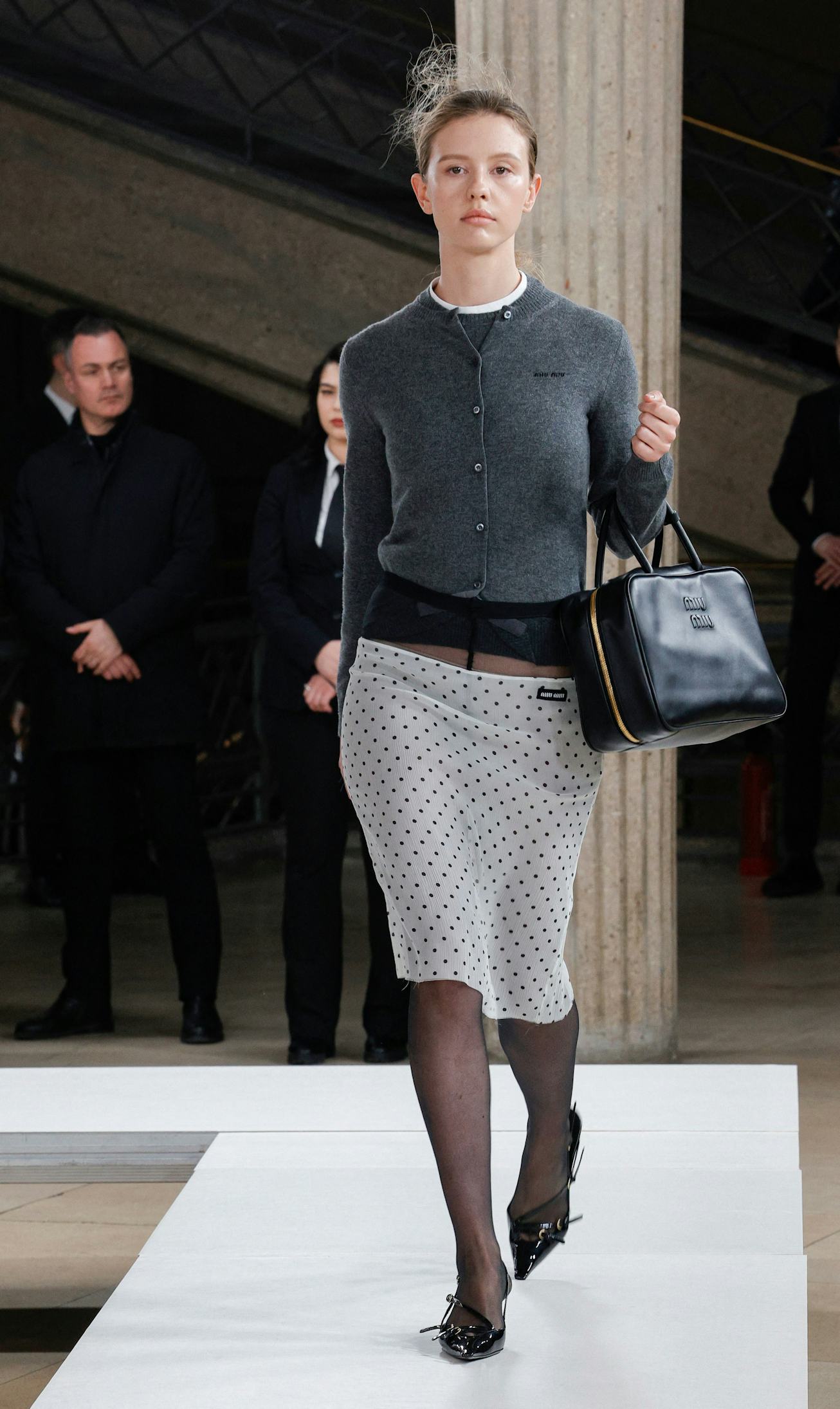 A model presents a creation from Miu Miu Womenswear Fall-Winter 2023-2024 collection during Paris Fa...