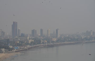 MUMBAI, INDIA - MARCH 4: City skyline engulfed in smog amid hazy weather, at Marine Drive, on March ...