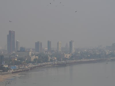 MUMBAI, INDIA - MARCH 4: City skyline engulfed in smog amid hazy weather, at Marine Drive, on March ...