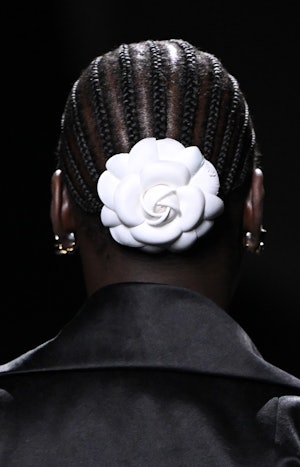 A model (hair detail) walks the runway during the  Chanel Womenswear Fall Winter 2023-2024 show as p...