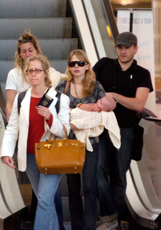 Actor Heath Ledger with wife Michelle Williams and daughter Matilda Rose Ledger leave Sydney Interna...