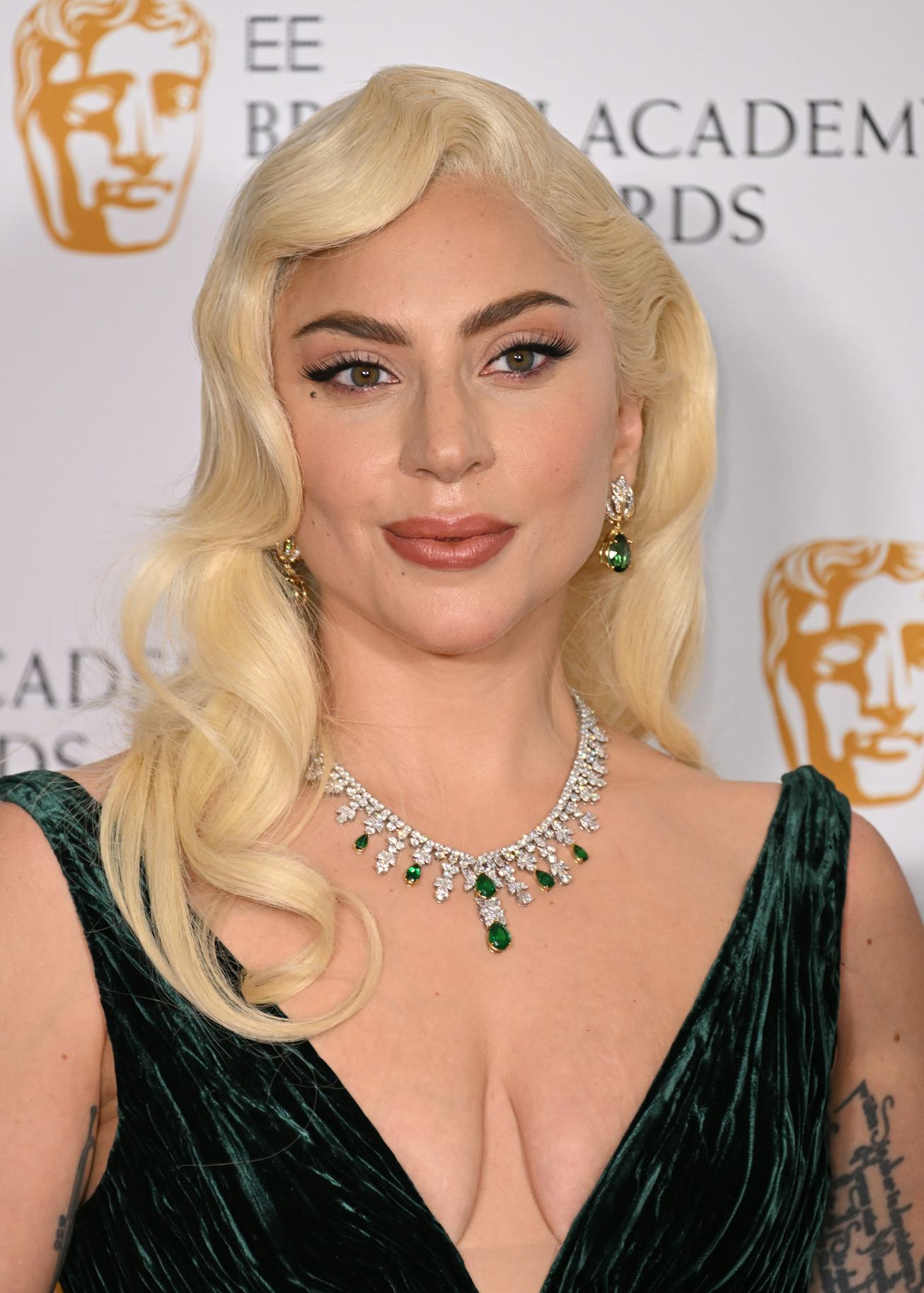 LONDON, ENGLAND - MARCH 13: Lady Gaga poses in the winners room during the EE British Academy Film A...