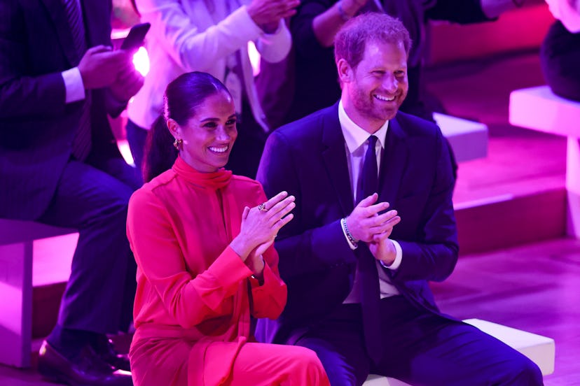 Meghan, Duchess of Sussex and Prince Harry, Duke of Sussex clapping during the Opening Ceremony of t...