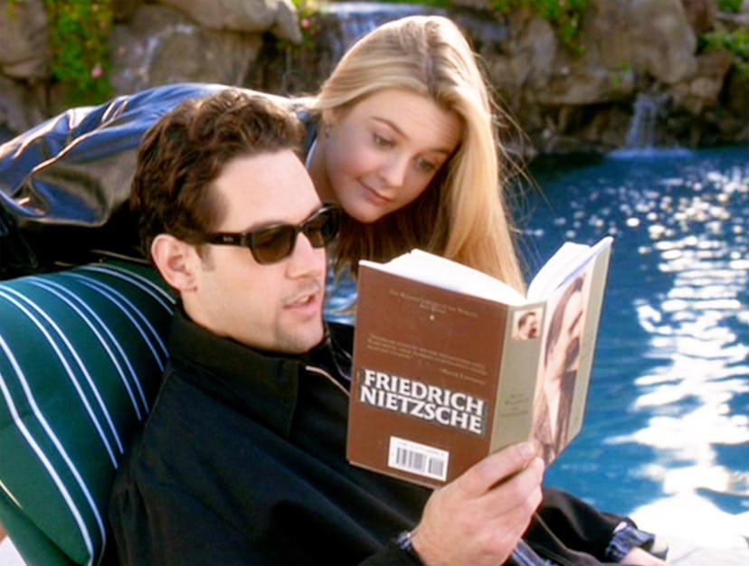 Paul Rudd (as Josh) and Alicia Silverstone (as Cher Horowitz). He reads Friedrich Nietzsche. in a ro...