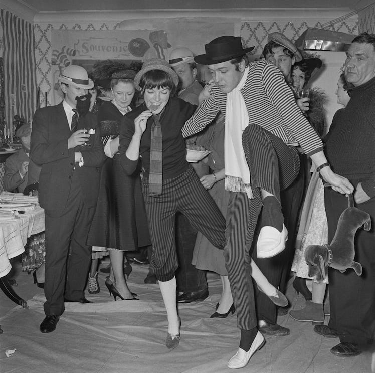English fashion designer Mary Quant dancing at a party with her husband, Alexander Plunket Greene.