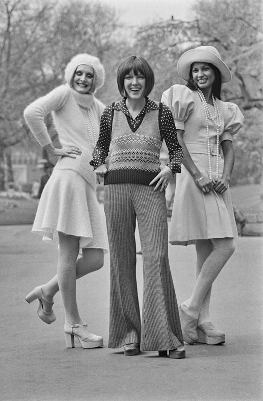 British fashion designer Mary Quant with two models at the launch of her Ginger Group autumn collect...