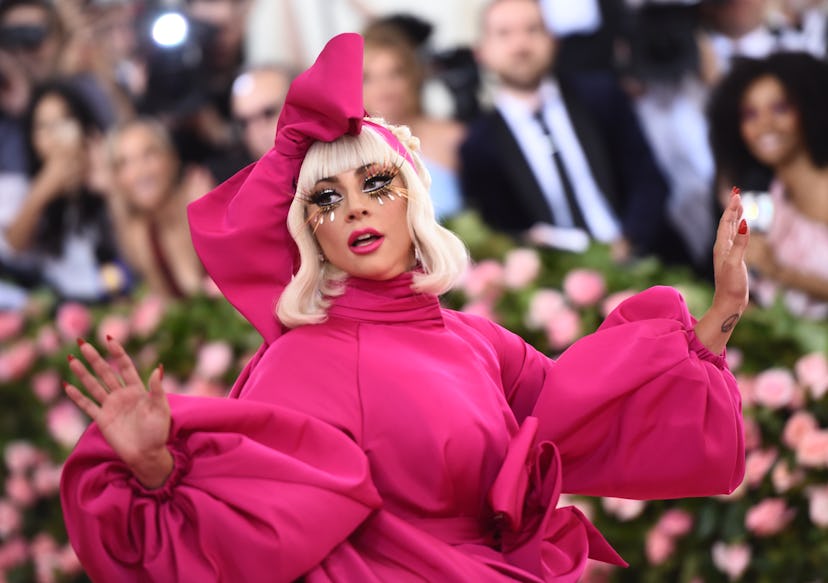 Lady Gaga at the 2019 met gala "camp" in a pink gown and matching headdress