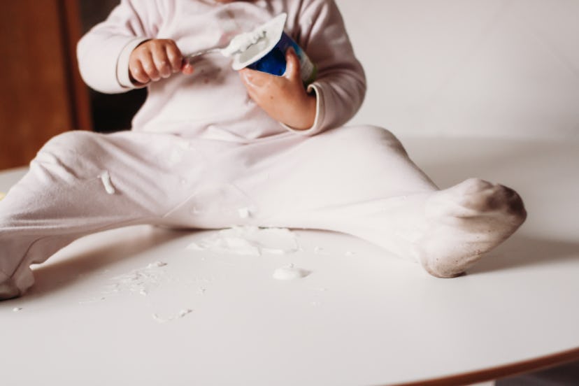 a baby making a huge yogurt mess. can babies have yogurt?