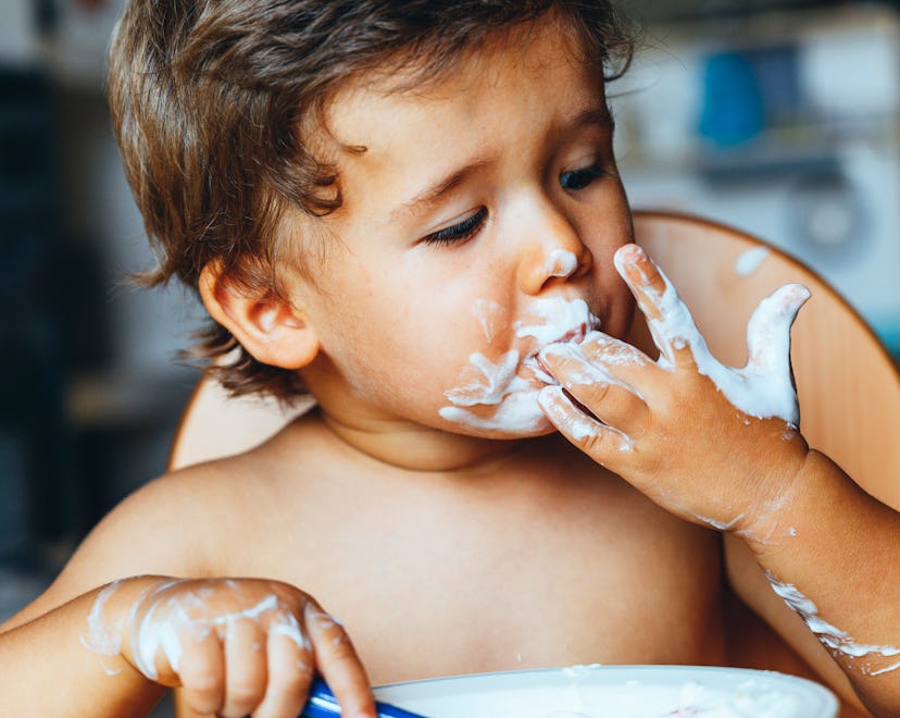 a baby eating yogurt, when can babies have yogurt.