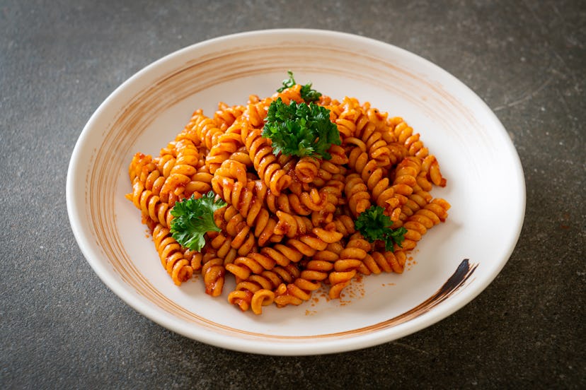 spiral or spirali pasta with tomato sauce and parsley - Italian food style