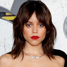 Jenna Ortega's dons a red lip and curtain bangs