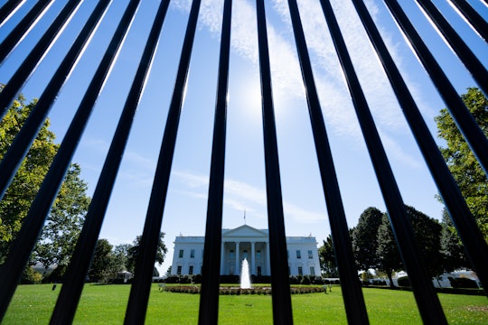 UNITED STATES - OCTOBER 6: The north front of the White House is seen through the security fence in ...