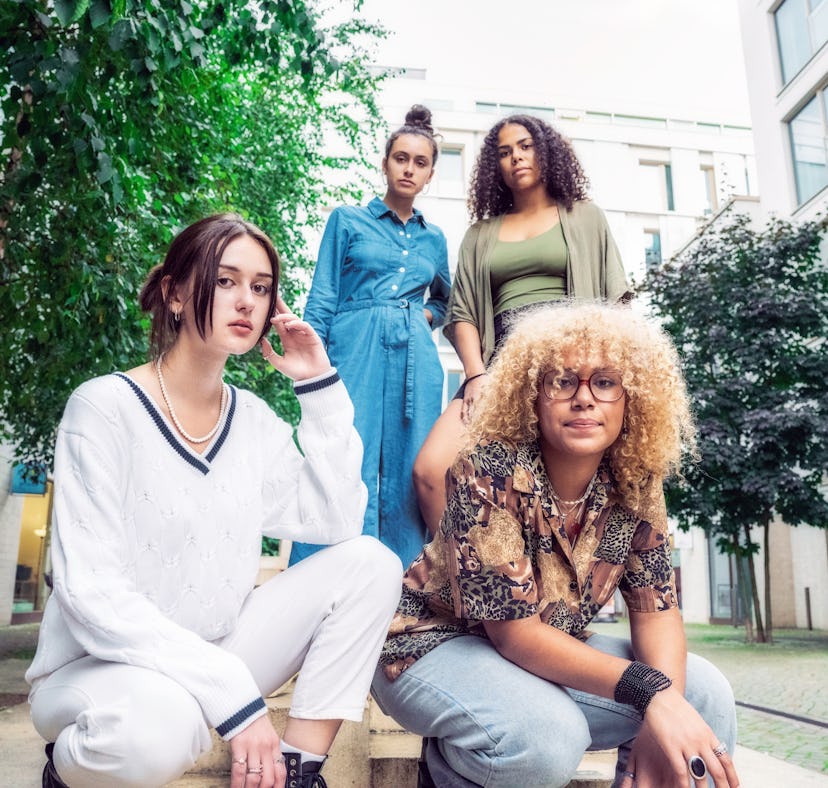four young woman look at a camera with serious expressions as they consider how the may 2023 full fl...
