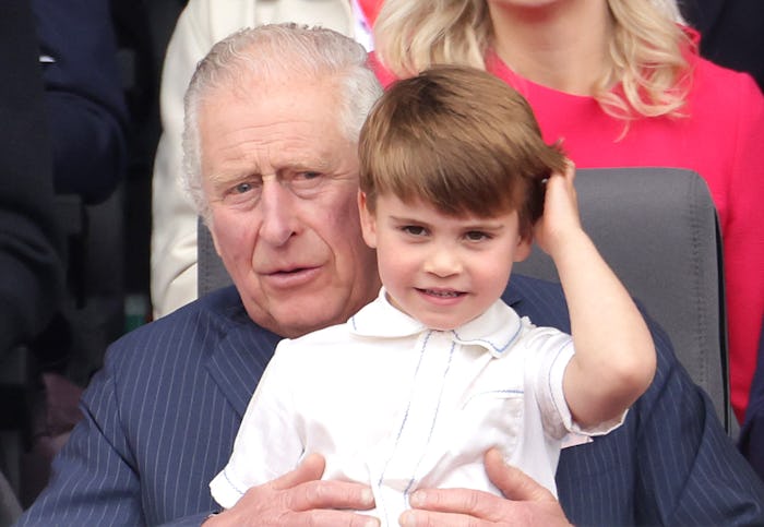 Prince Louis wanted to sit on his grandpa's lap.