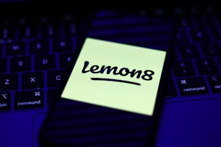 A laptop keyboard and Lemon8 logo displayed on a phone screen are seen in this illustration photo ta...