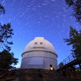 Star trails above the 100-inch (2.5 m) Hooker telescope at Mount Wilson Observatory, California, USA...