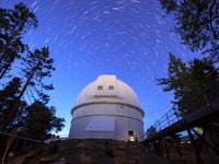 Star trails above the 100-inch (2.5 m) Hooker telescope at Mount Wilson Observatory, California, USA...