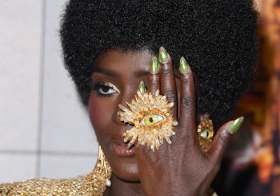 Jodie Turner-Smith green and gold nails at Murder Mystery 2 premiere