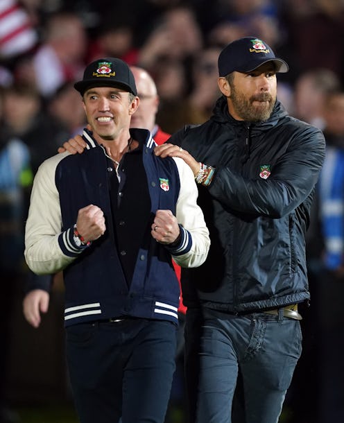 Wrexham co-owners Rob McElhenney and Ryan Reynolds celebrate following promotion to the EFL followin...