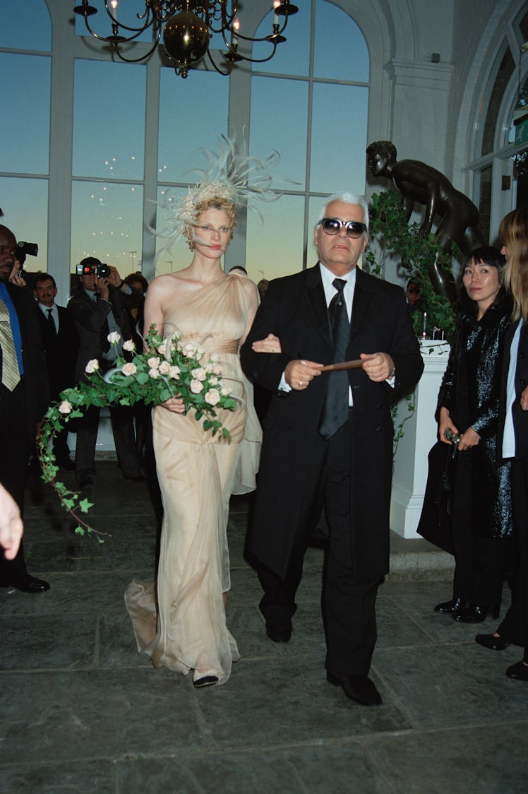 Fashion designer Karl Lagerfeld gives away supermodel Kristen McMenamy at her wedding to photographe...